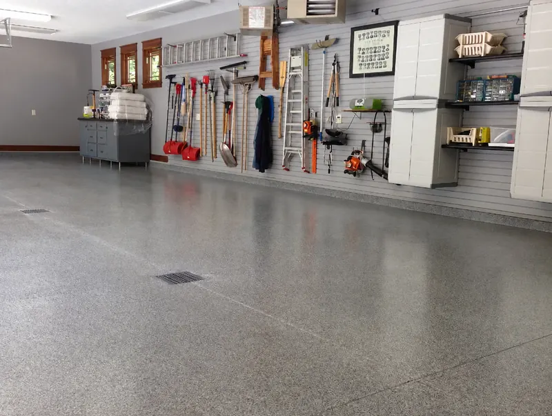 Coated garage floor in a workshop with tool wall